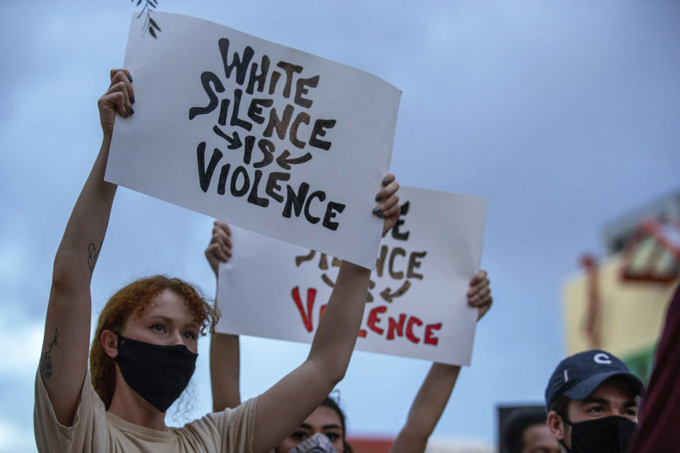 Demonstrators protest the death of George Floyd in downtown Albuquerque, N.M., Sunday, May 31, 2020. Floyd was a black man who died in police custody in Minneapolis on May 25. (AP Photo/Andres Leighton)