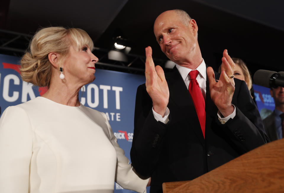 Republican Senate candidate Rick Scott thanks his wife Ann as he speaks to supporters at an election watch party, Wednesday, Nov. 7, 2018, in Naples, Fla. (AP Photo/Wilfredo Lee)