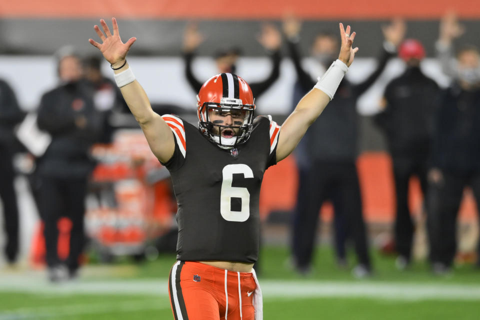 Cleveland Browns quarterback Baker Mayfield celebrates after running back Kareem Hunt scored a touchdown during the second half of the team's NFL football game against the Cincinnati Bengals, Thursday, Sept. 17, 2020, in Cleveland. The Browns won 35-30. (AP Photo/David Richard)