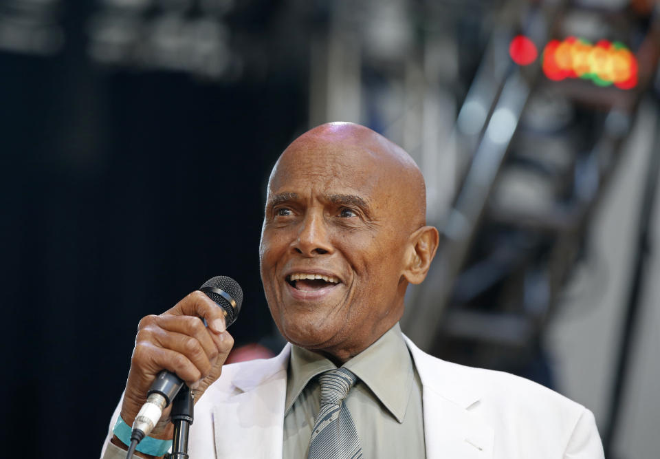 FILE - Singer and activist Harry Belafonte speaks during a memorial tribute concert for folk icon and civil rights activist Pete Seeger in New York on July 20, 2014. Belafonte died Tuesday of congestive heart failure at his New York home. He was 96. (AP Photo/Kathy Willens, file)