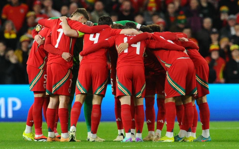 Wales players in a huddle