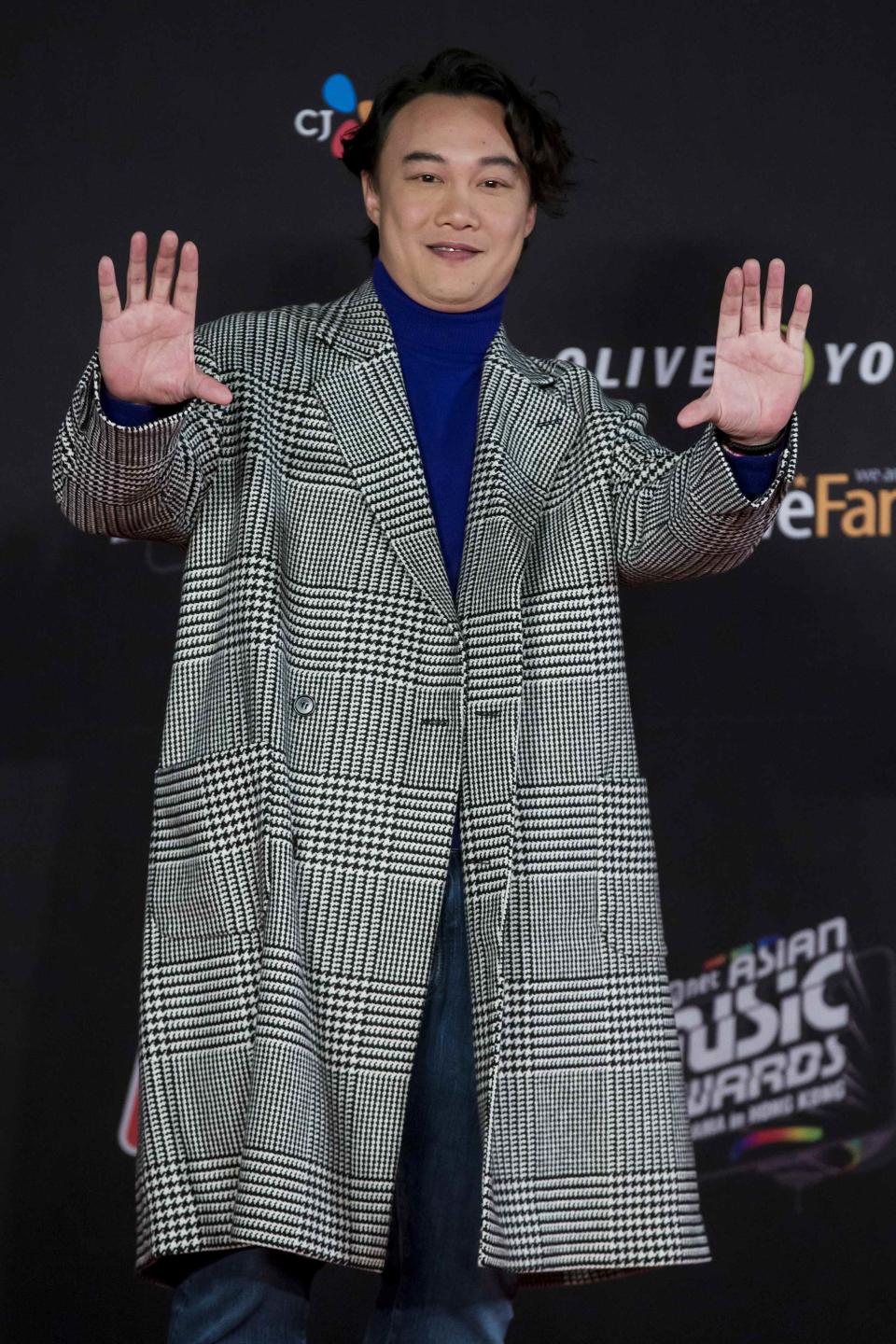 Hong Kong singer Eason Chan poses on the red carpet as he attends the 2014 Mnet Asian Music Awards (MAMA) in Hong Kong