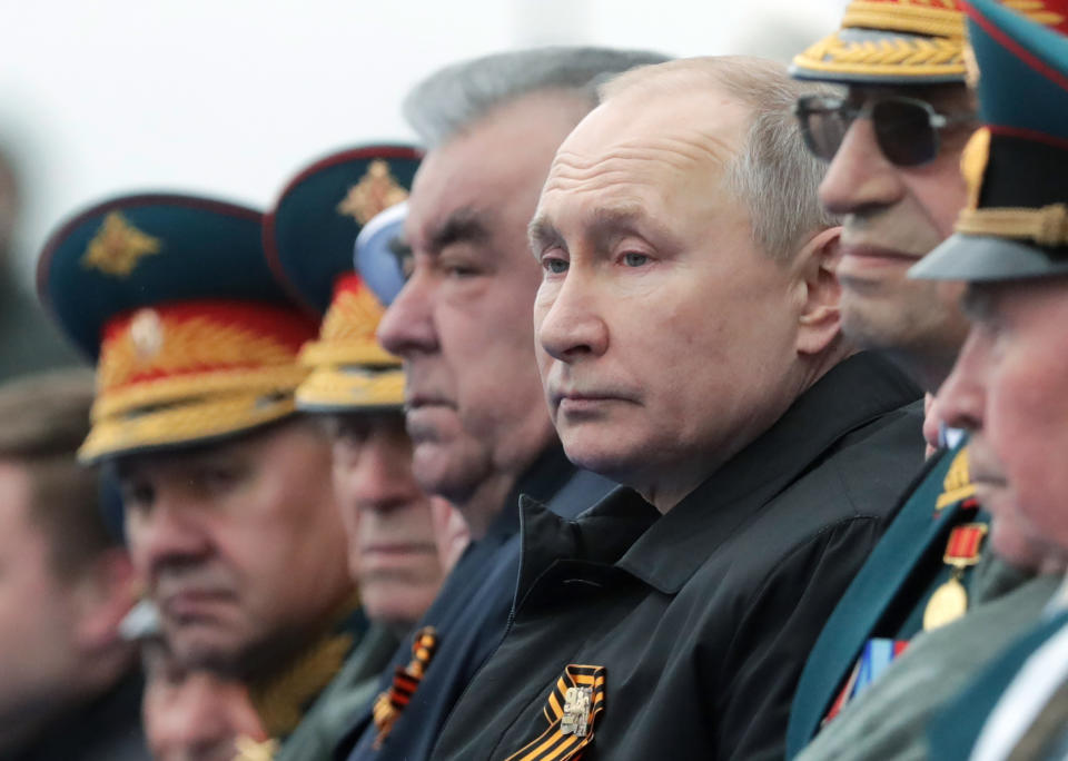 Russian President Vladimir Putin, center right, and Tajikistan's President Emomali Rakhmon, center left, watch the Victory Day military parade in Moscow, Russia, Sunday, May 9, 2021, marking the 76th anniversary of the end of World War II in Europe. (Mikhail Metzel, Sputnik, Kremlin Pool Photo via AP)