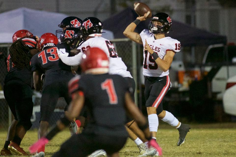 North Florida Christian junior quarterback JP Pickles (19) passes the ball in a game against Munroe on Oct. 28, 2022, at Corry Field. NFC won, 56-40.