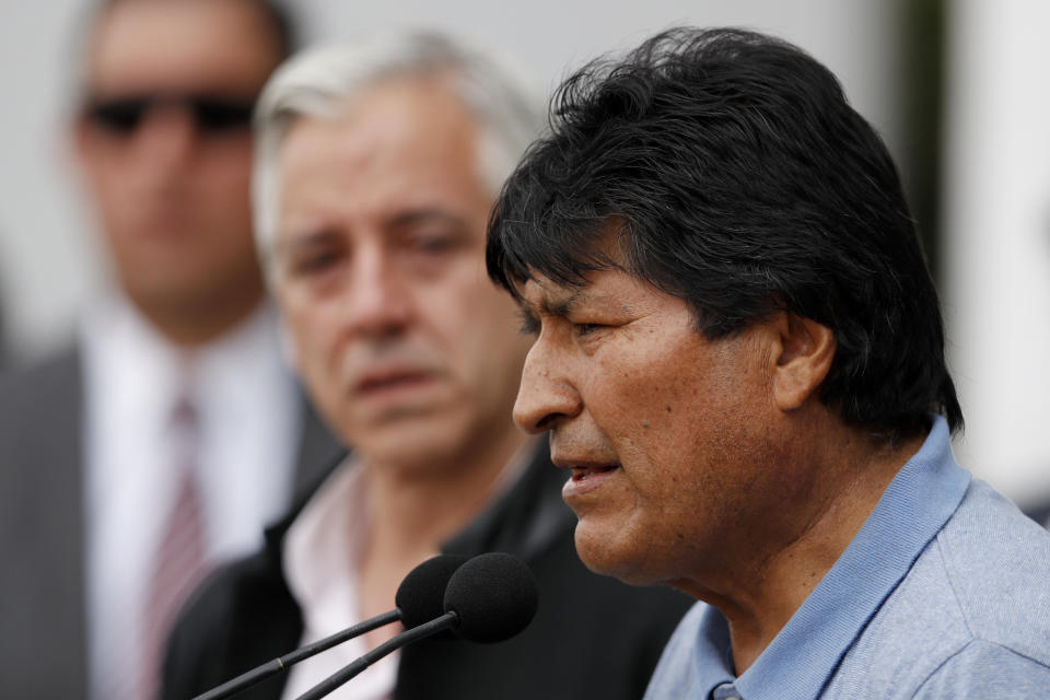 Former Bolivian President Evo Morales speaks upon his arrival in Mexico City, Tuesday, Nov. 12, 2019. Mexico granted asylum to Morales, who resigned on Nov. 10 under mounting pressure from the military and the public after his re-election victory triggered weeks of fraud allegations and deadly protests. (AP Photo/Eduardo Verdugo)