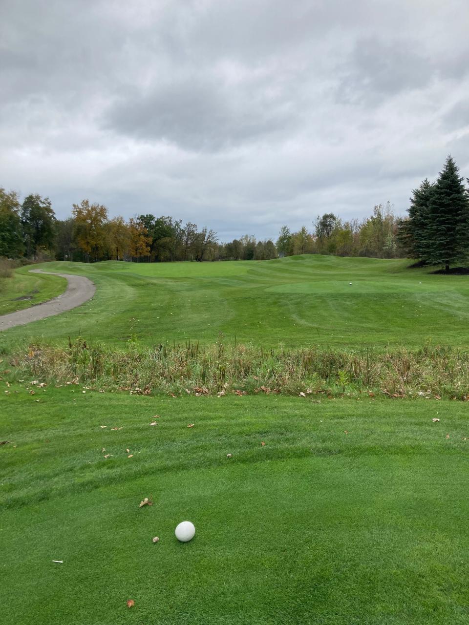 Opening tee shot on the par-5 first hole, which takes a severe dogleg right, at Huntmore Golf Club in Brighton Township.