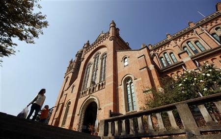 People walk outside Sheshan Cathedral in the outskirts of Shanghai October 28, 2013. REUTERS/Aly Song