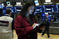 Trader Ashley Lara works on the floor of the New York Stock Exchange, Wednesday, Sept. 22, 2021. Stocks rose broadly on Wall Street Wednesday ahead of an update from the Federal Reserve on how and when it might begin easing its extraordinary support measures for the economy. (AP Photo/Richard Drew)