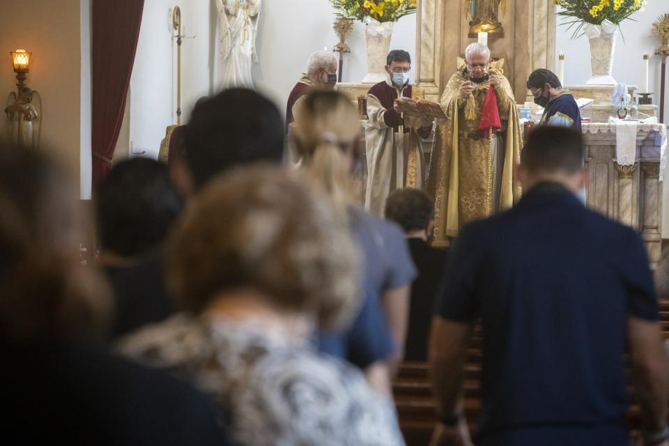 Father Armenag Bedrossian leads a Sunday service