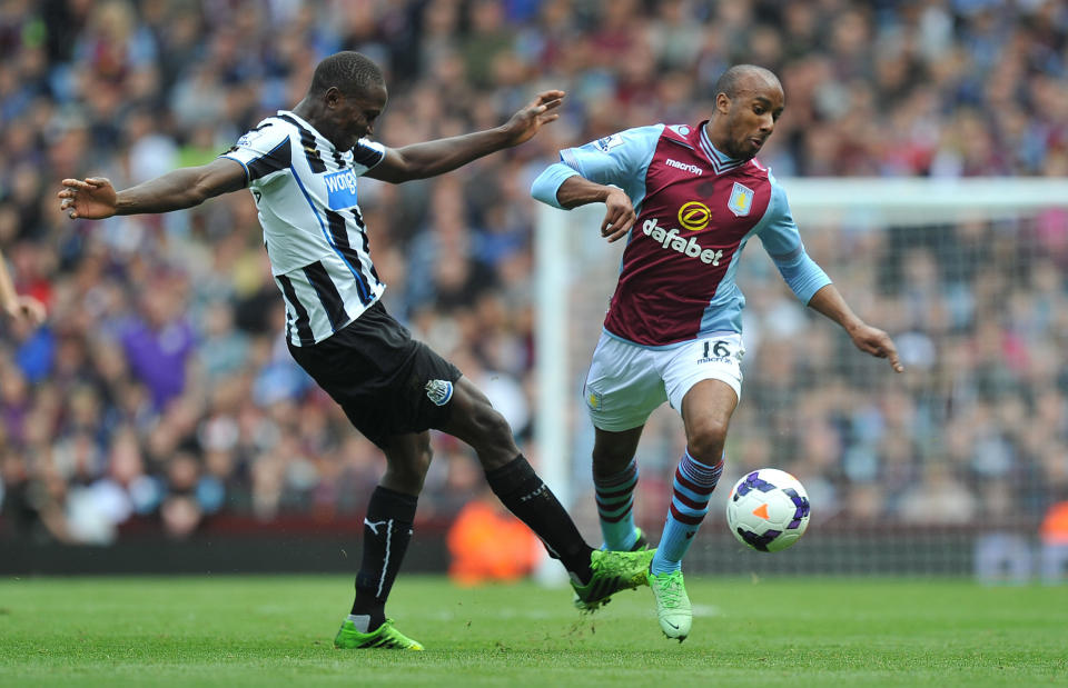 Aston Villa's Fabian Delph is fouled by Newcastle United's Mapou Yanga-Mbiwa during the Barclays Premier League match at Villa Park, Birmingham.