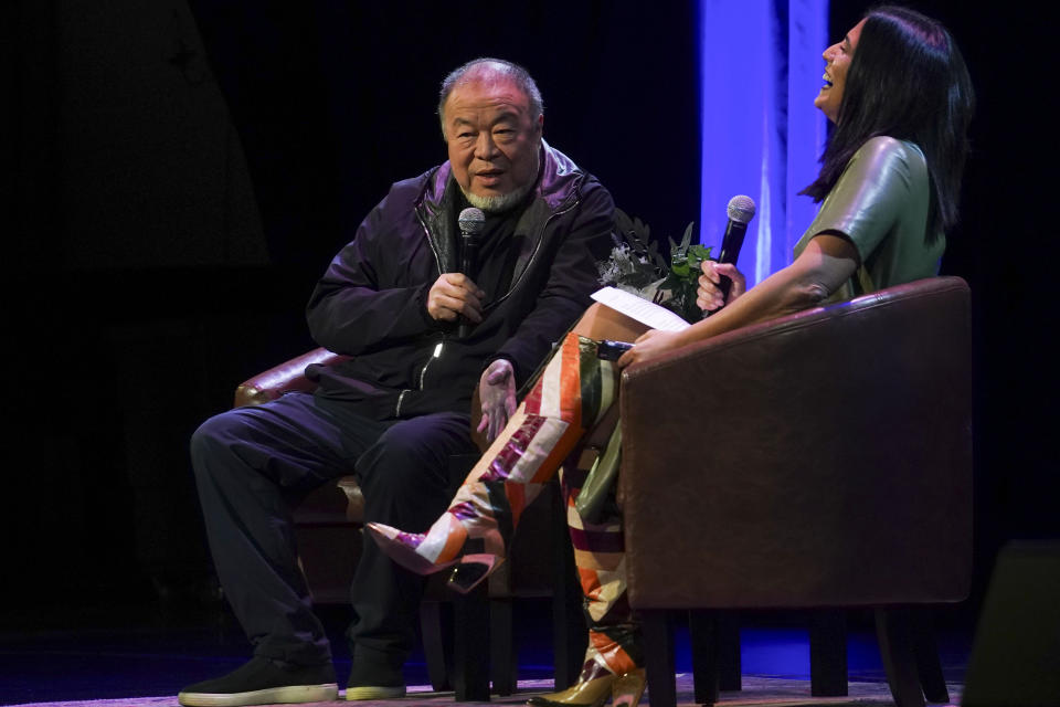 Visual artist and activist Ai Weiwei, left, speaks during a conversation with author Mira Jacob on stage at The Town Hall theatre, Tuesday, Jan. 23, 2024, in New York. Ai was in New York to discuss his new book, the graphic memoir “Zodiac,” structured around the animals of the Chinese Zodiac, with additional references to cats. (AP Photo/Bebeto Matthews)