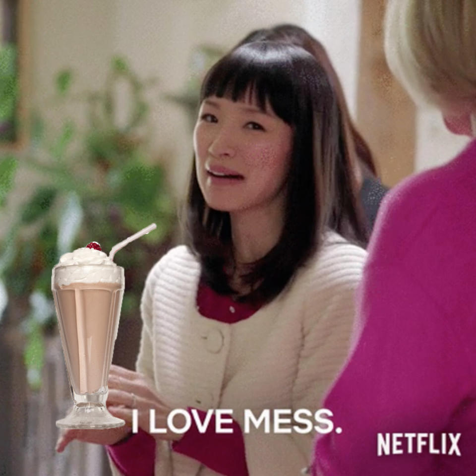 Marie Kondo holding a milkshake saying, "I love mess"
