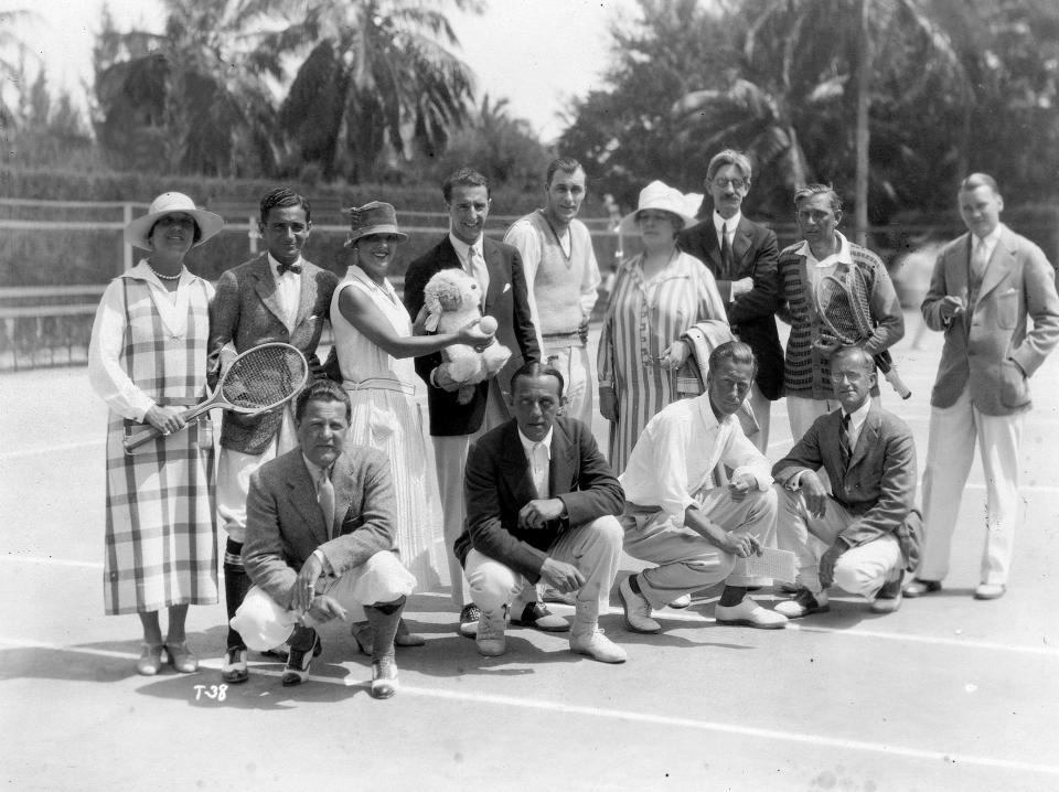 While visiting Palm Beach in the early 1930s, Bill Tilden (standing, fifth from left) was joined by celebrities and others for fun at the Palm Beach Tennis Club, including songwriter Irving Berlin (standing, second from left) and the club's tennis pro George Agutter (kneeling, third from left).
