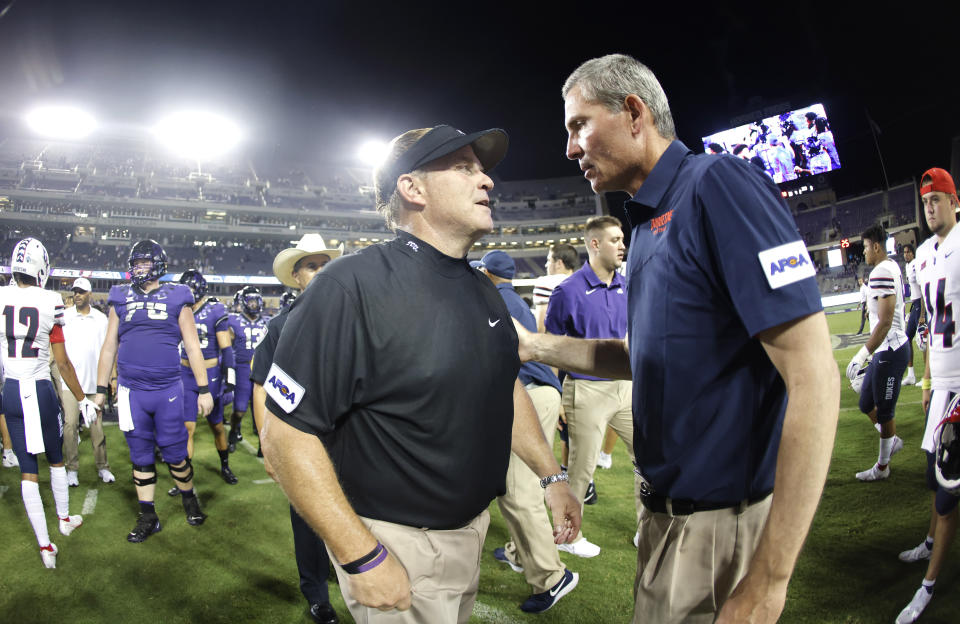 TCU head coach Gary Patterson and Duquesne head coach Jerry Schmitt talk following an NCAA college football game Saturday, Sept. 4, 2021, in Fort Worth, Texas. TCU won 45-3. (AP Photo/Ron Jenkins)