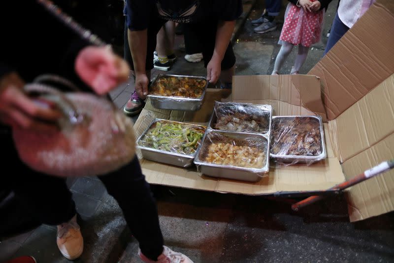 Food is delivered for a free Christmas dinner offered by a local restaurant to protesters in Hong Kong