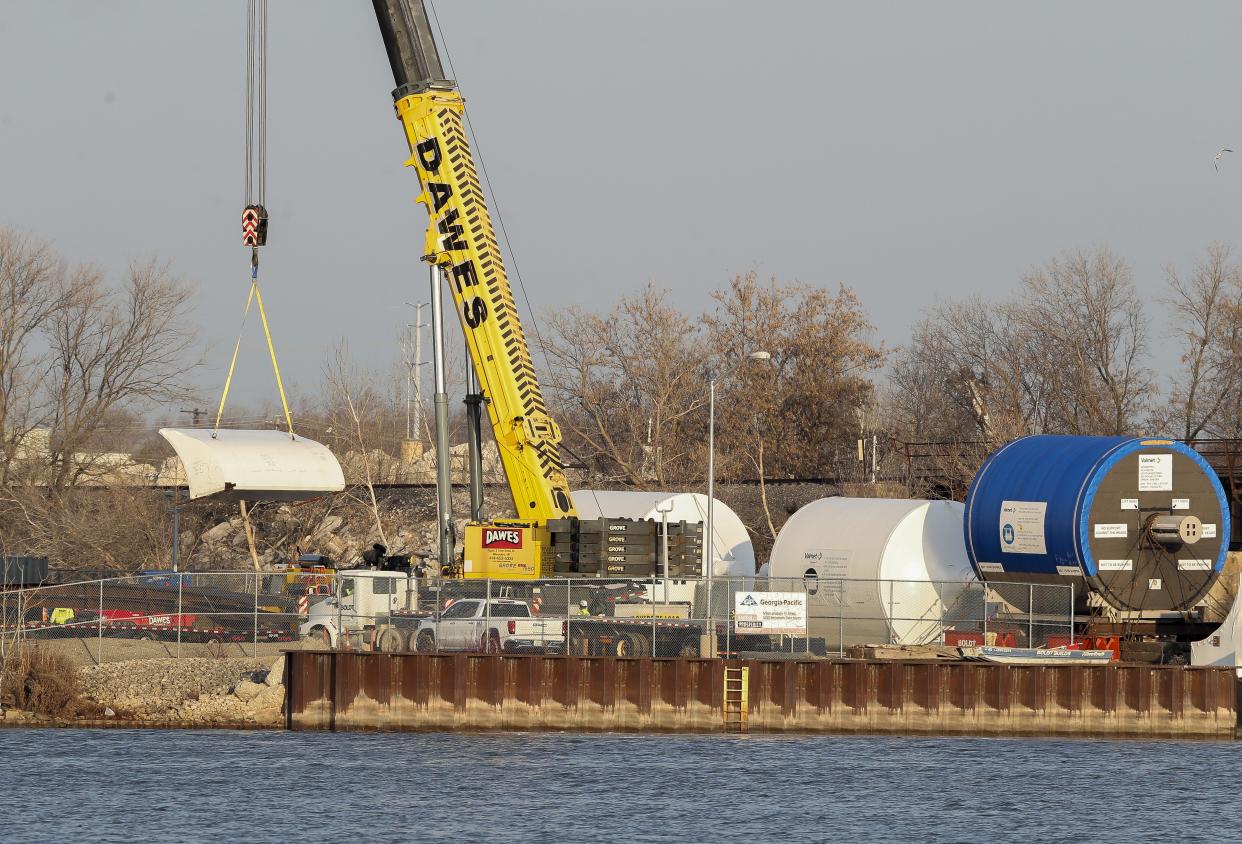 A dryer hood is moved off of a barge on Friday at the Georgia-Pacific Broadway mill in Green Bay. The barge delivered a Yankee dryer, TAD dryers and hoods for the mill's Brawny expansion project.