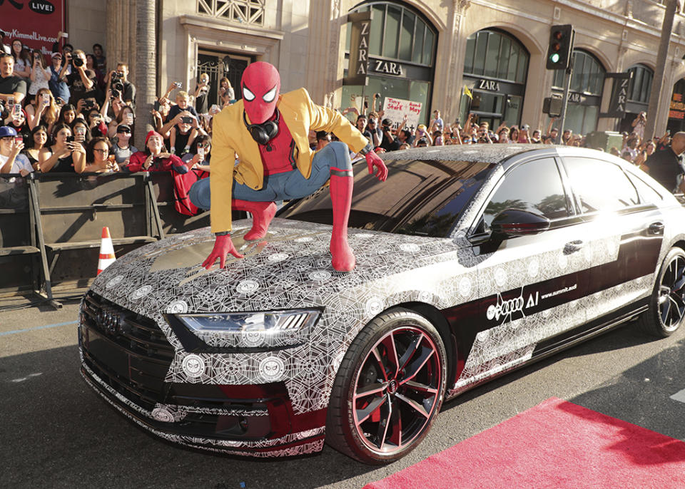<p>Spidey hops a ride at the <a rel="nofollow" href="https://www.yahoo.com/movies/film/spider-man-homecoming" data-ylk="slk:Spider-Man: Homecoming;elm:context_link;itc:0;sec:content-canvas" class="link "><em>Spider-Man: Homecoming</em></a> premiere at TCL Chinese Theatre on June 28, 2017, in Hollywood. (Photo: Eric Charbonneau/Invision/AP Images) </p>