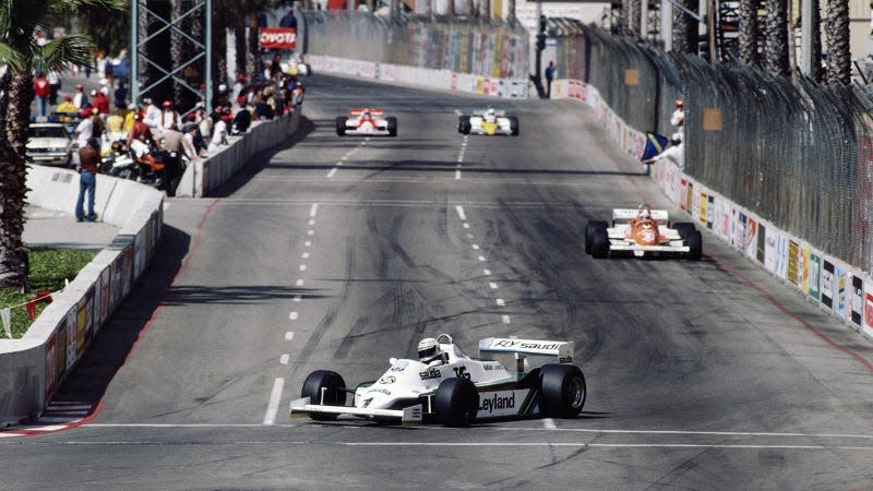 A photo of Formula 1 cars racing at Long Beach Street Circuit, California. 