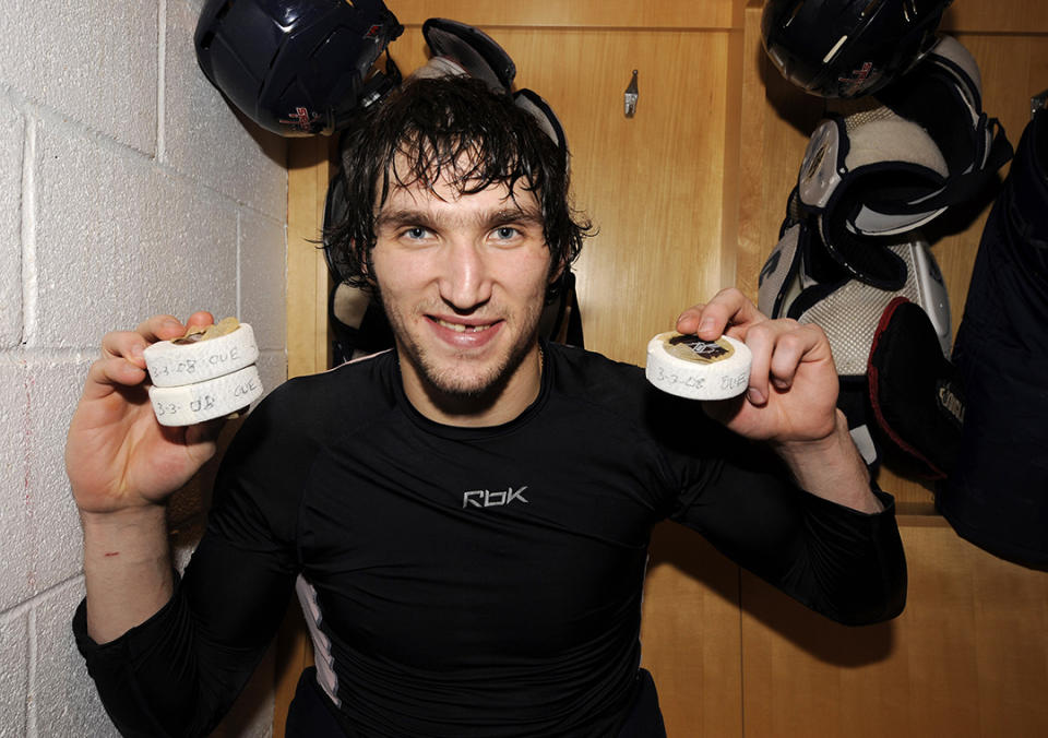 <p>Alex Ovechkin #8 of the Washington Capitals celebrates scoring his 50th, 51st and 52nd goals of season after a hockey game against the Boston Bruins on March 3, 2008 at the Verizon Center in Washington D.C. (Photo by Mitchell Layton/NHLI via Getty Images) </p>