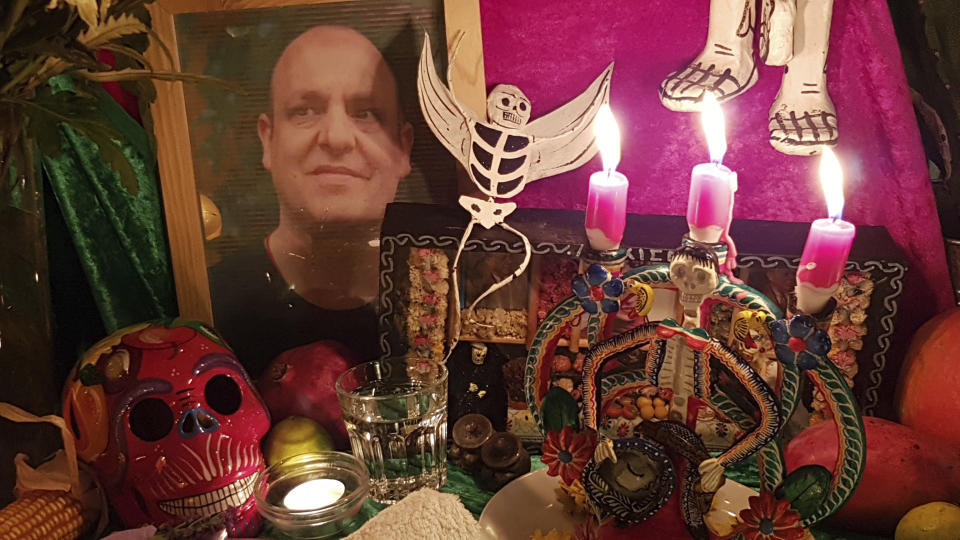 This Nov. 16, 2019 photo shows an altar made by mortician and death cafe host Angela Craig-Fournes in honor of Death Cafe founder Jon Underwood, who died in 2017. (Angela Craig-Fournes via AP)