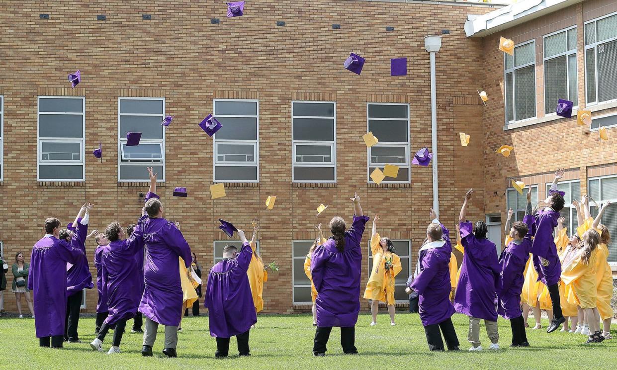 2023 Sebring McKinley High School graduating seniors throw their caps into the air outside the school following commencement Sunday afternoon, May 21, 2023. Ed Hall Jr, Special to The Review