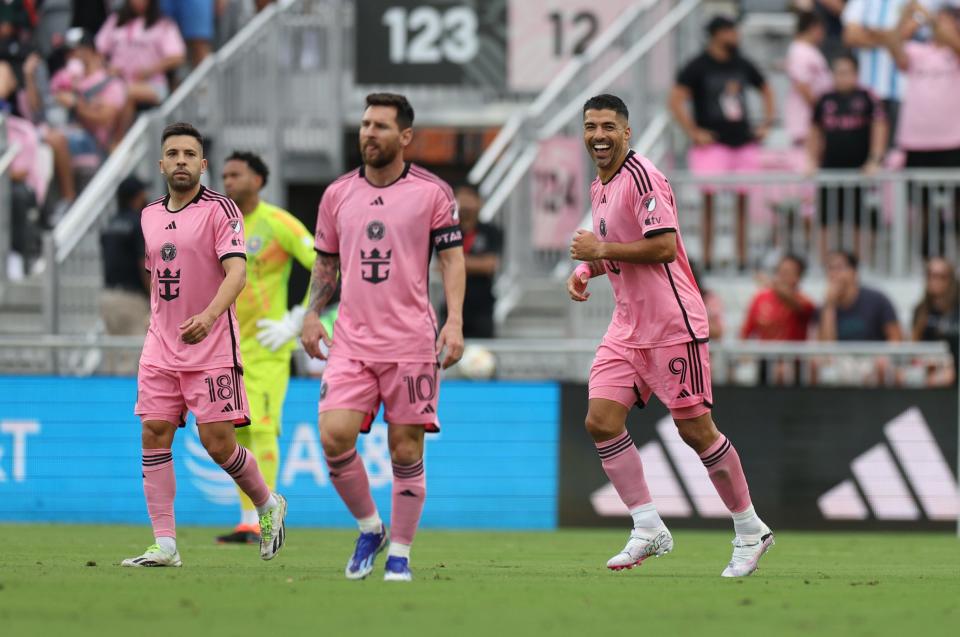 Inter Miami forward Luis Suarez, far right, celebrates with teammates Jordi Alba, left and Lionel Messi, center, after scoring his second goal of the first half against Orlando City.