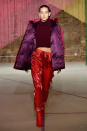 <p>Model wears a burgundy top, red trousers, and purple puffer jacket at the Milly Fall/Winter 2018 show. (Photo: Courtesy of Greg Kessler) </p>