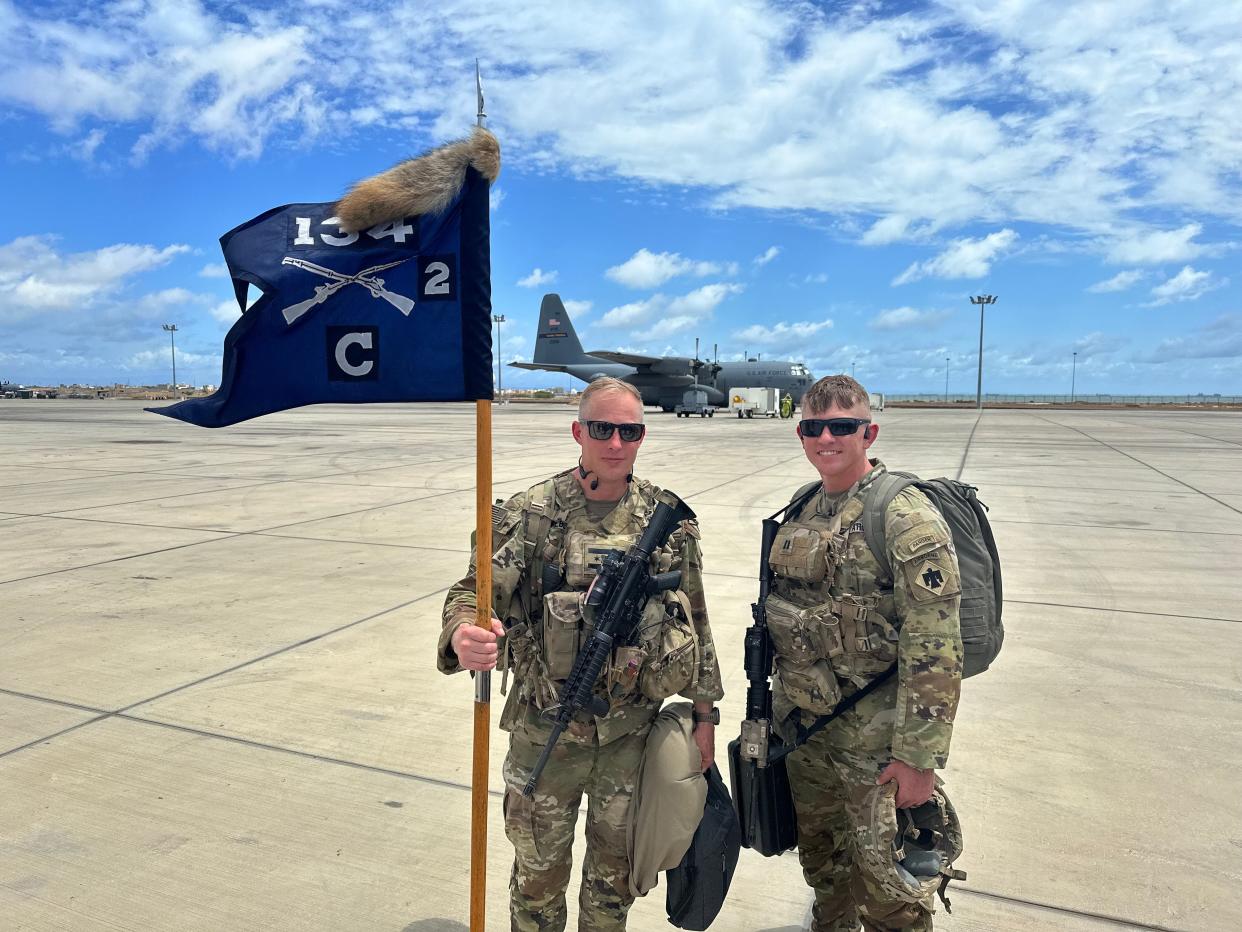 Indiana National Guard Major Kyle Allen, right, of Elkhart, poses in 2023 at the air base near at Camp Simba, Kenya, where he's stationed for Operation Enduring Freedom.