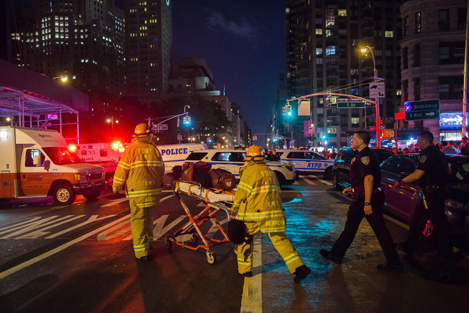 <p>Police and firefighters work near the scene of an apparent explosion in Manhattan’s Chelsea neighborhood, in New York, Sept. 17, 2016. A law enforcement official tells The Associated Press that an explosion in the Chelsea neighborhood appears to have come from a construction toolbox in front of a building. The official spoke on condition of anonymity because the person wasn’t authorized to speak about an ongoing investigation. More than two dozen people have sustained minor injuries in the explosion on West 23rd Street. (Photo: Andres Kudacki/AP) </p>