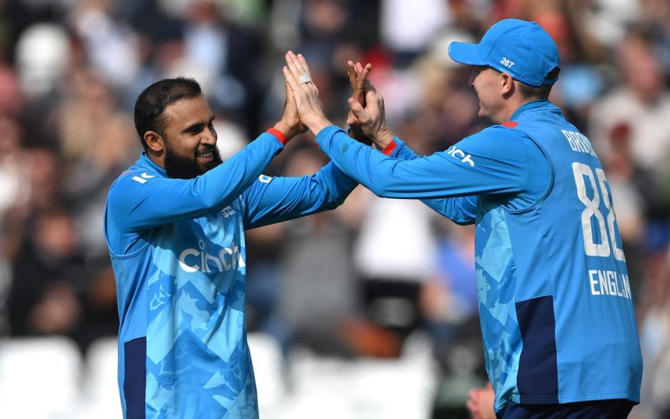 Adil Rashid celebrates his 200th ODI wicket with Harry Brook.