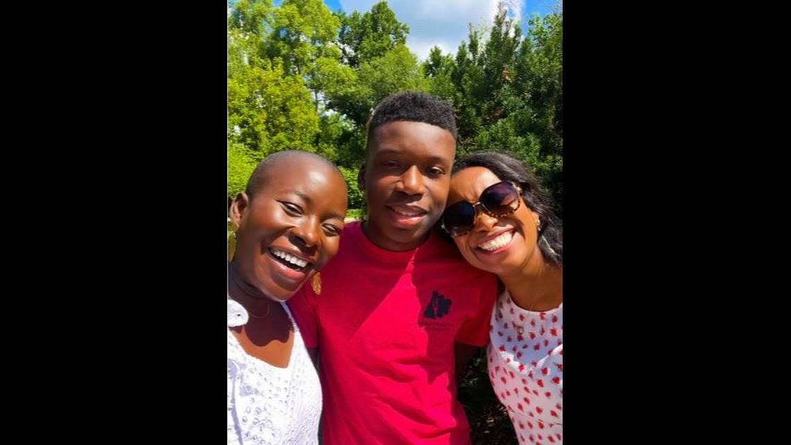 Ralph Yarl smiles for a photo with his aunt, Faith Spoonmore (left), and his mother, Cleo Nagbe (right).