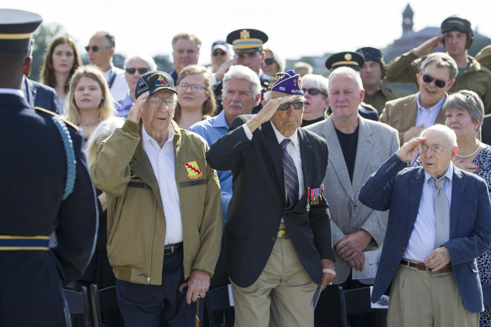 World War II veterans Clarence Smoyer, 96, left, Joseph Caserta and Buck Marsh salute during a ceremony to present the Bronze Star to Smoyer at the World War II Memorial, Wednesday, Sept. 18, 2019, in Washington. Smoyer fought with the U.S. Army's 3rd Armored Division, nicknamed the Spearhead Division. In 1945, he defeated a German Panther tank near the cathedral in Cologne, Germany — a dramatic duel filmed by an Army cameraman that was seen all over the world. (AP Photo/Alex Brandon)