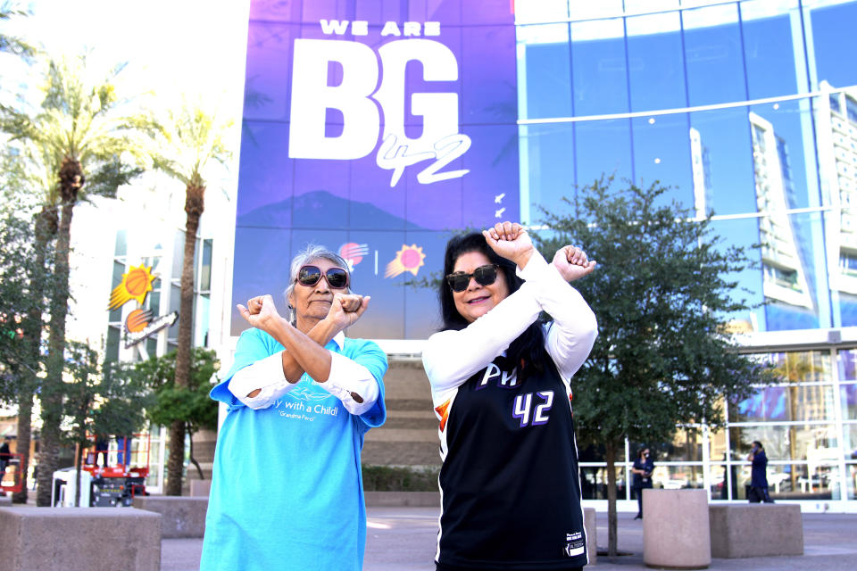 Perci Ami, left, of Laveen, Ariz., and Patty Talahongva show support for Brittney Griner, Thursday, Dec. 8, 2022, in Phoenix. Griner was released from a Russian prison in a prisoner swap earlier in the day. (AP Photo/Rick Scuteri)