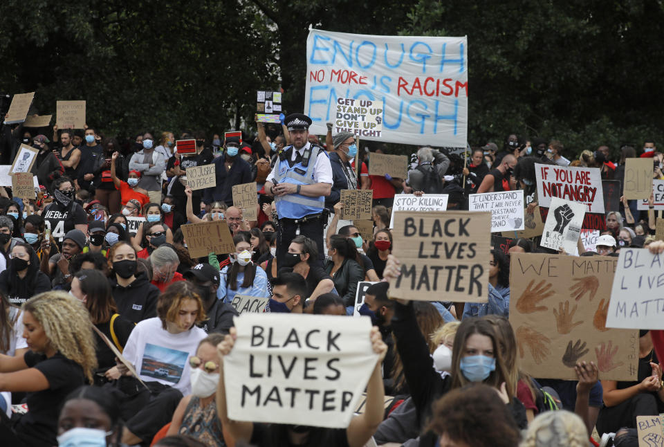 Protesters take part in a demonstration on Wednesday, June 3, 2020, in Hyde Park, London, over the death of George Floyd, a black man who died after being restrained by Minneapolis police officers on May 25. Protests have taken place across America and internationally, after a white Minneapolis police officer pressed his knee against Floyd's neck while the handcuffed black man called out that he couldn't breathe. The officer, Derek Chauvin, has been fired and charged with murder. (AP Photo/Kirsty Wigglesworth)