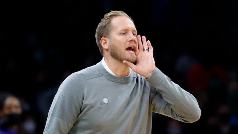 Phoenix Suns associate head coach Kevin Young yells to his team during the first half of an game against the Boston Celtics, Friday, Dec. 31, 2021, in Boston. Young is among the potential candidates who could replace Mark Pope in Provo.