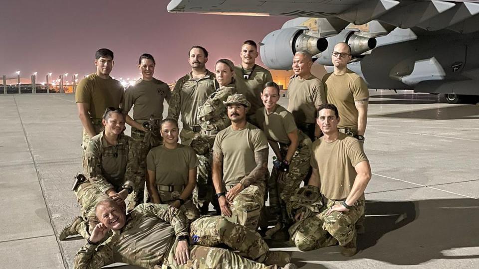 The Air Force's aeromedical evacuation and critical care air transport team members who responded to the suicide bombing at the Kabul airport's Abbey Gate on Aug. 26, 2021, pose for a photo before leaving Afghanistan. (Courtesy of Katie Lunning)