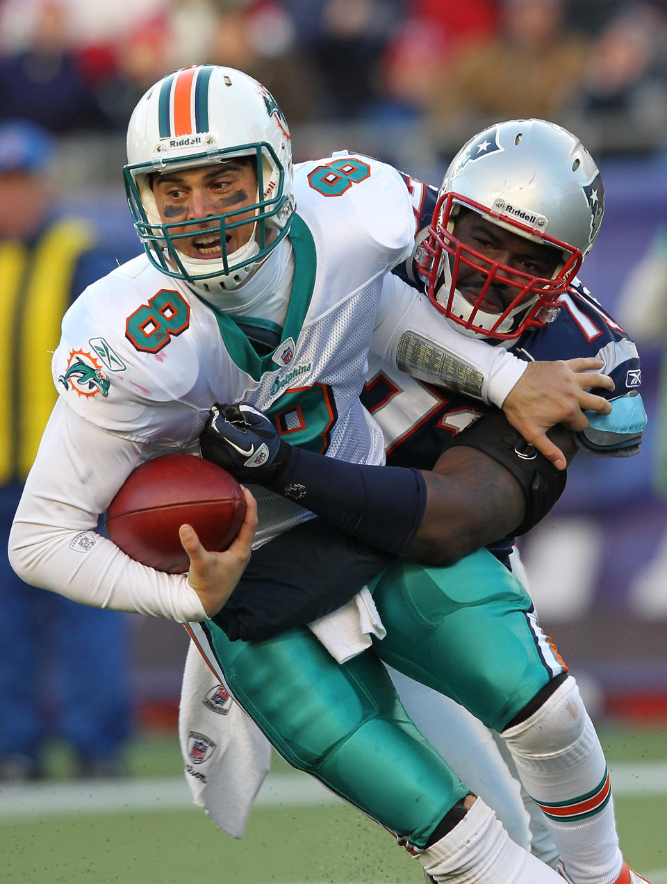 Matt Moore #8 of the Miami Dolphins is sacked by Brandon Deaderick #71 of the New England Patriots in the second half at Gillette Stadium on December 24, 2011 in Foxboro, Massachusetts. (Photo by Jim Rogash/Getty Images)