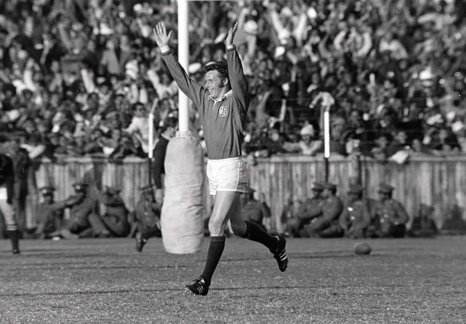 Williams celebrates after scoring the first of his two tries for Lions against South Africa at Port Elizabeth in 1974 - Colorsport