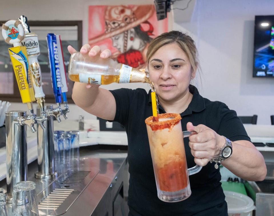 General manager Elizabeth Sopo prepares a Michelada cocktail at La Barra Del Taco restaurant at 3811 West Navy Boulevard in Pensacola on Wednesday, March 15, 2023.