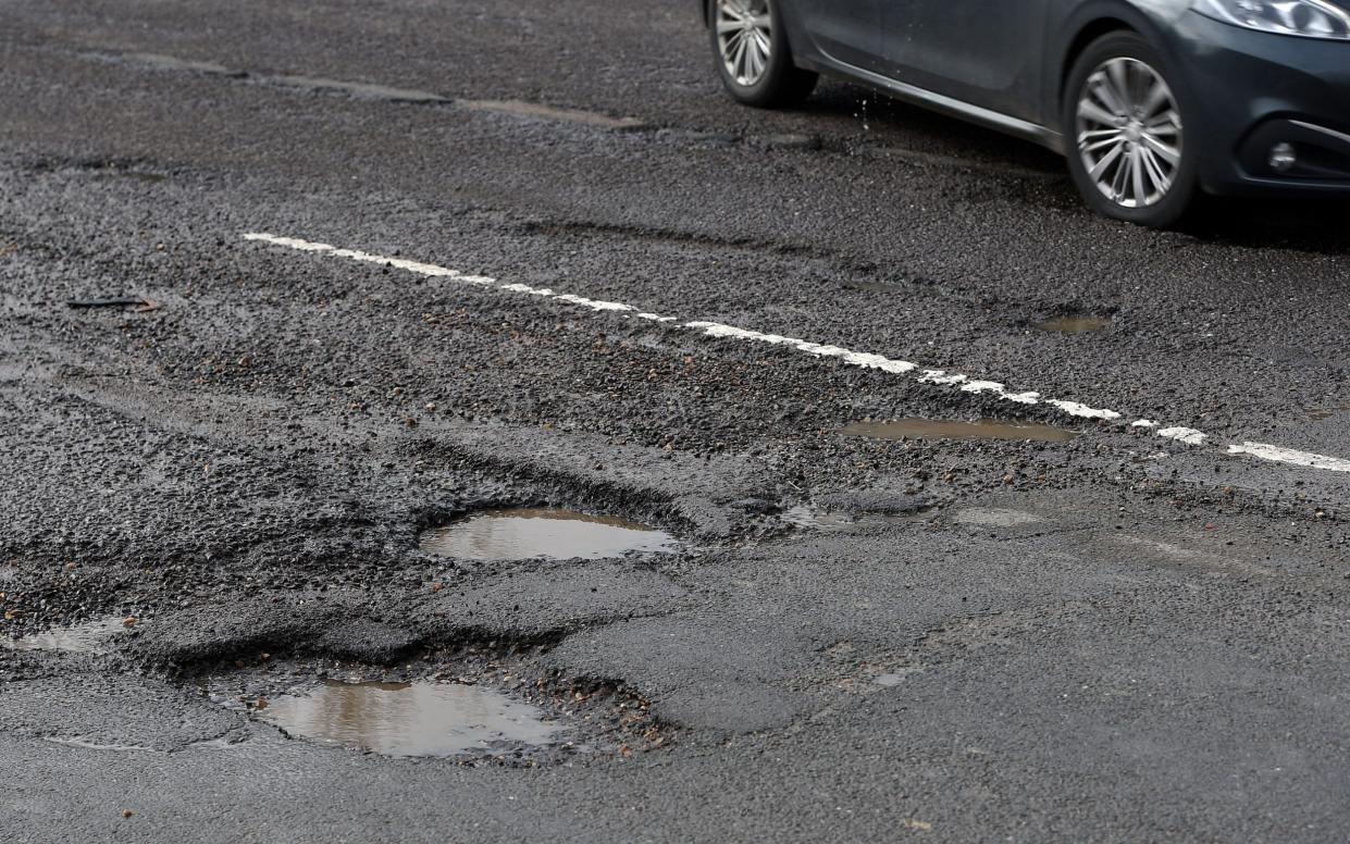 The amount spent by councils on filling potholes dropped from £144 million in 2015 to £96 million last year - Joe Giddens/pa