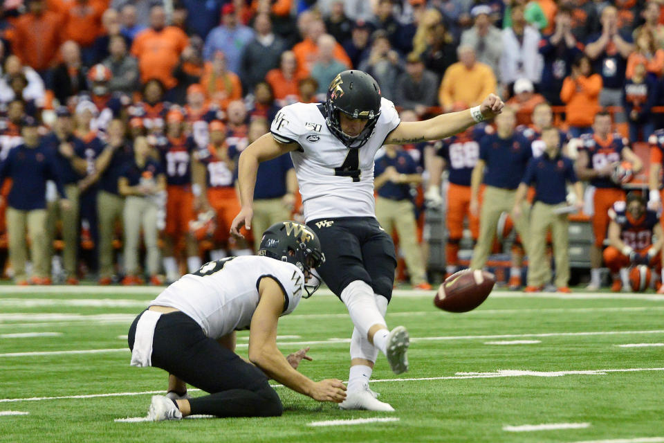 FILE - In this Nov. 30, 2019, file photo, Wake Forest kicker Nick Sciba (4) kicks a field goal to tie the game against Syracuse as time runs out in the second half of an NCAA college football game, in Syracuse, N.Y. Sciba was selected to The Associated Press All-Atlantic Coast Conference football team, Tuesday, Dec. 10, 2019. (AP Photo/Adrian Kraus, File)