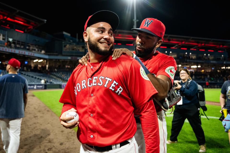 WooSox teammates Wilyer Abreu, left, and Narciso Crook catch up before Abreu performed a gender reveal with his wife following Saturday's WooSox game.