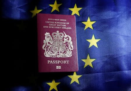 FILE PHOTO: A British passport is pictured in front of an European Union flag in this photo illustration taken in Brussels, Belgium, June 20, 2016. REUTERS/Francois Lenoir/Illustration