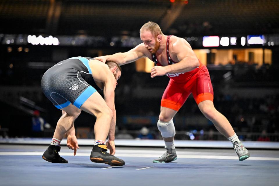 Kyle Snyder, red, is a three-time Senior world champion and 2016 Olympic gold medalist.