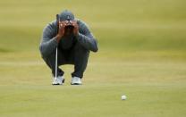 Tiger Woods of the U.S. lines up a putt on the seventh green during the first round of the British Open golf championship on the Old Course in St. Andrews, Scotland, July 16, 2015. REUTERS/Lee Smith . Picture Supplied by Action Images