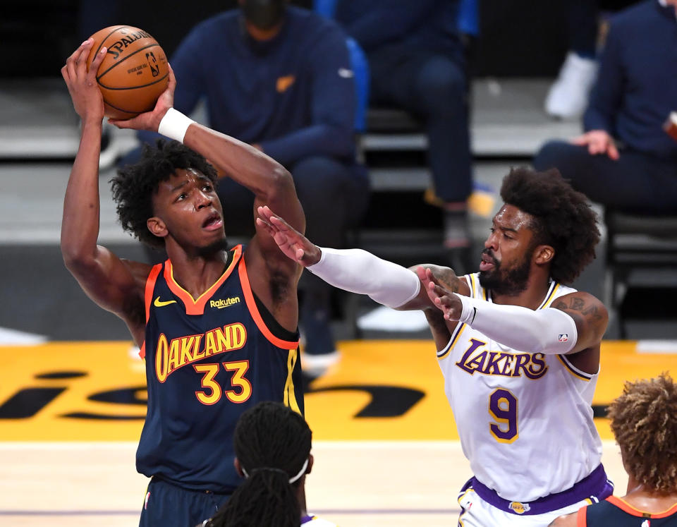 Feb 28, 2021; Los Angeles, California, USA; Golden State Warriors center James Wiseman (33) takes a shot over Los Angeles Lakers guard Wesley Matthews (9) in the first half of the game at Staples Center. 