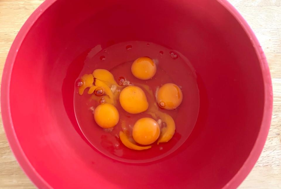 Cracking the eggs for Ina Garten's cacio e pepe eggs