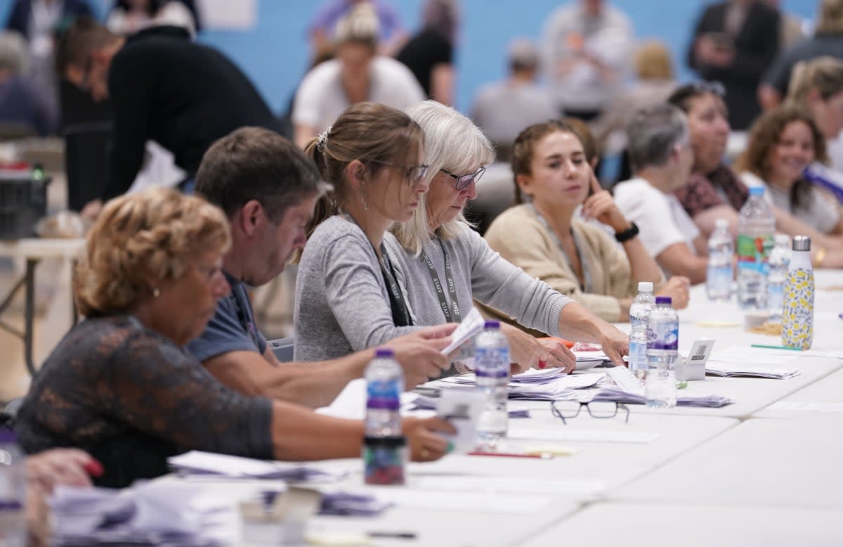Votes are counted at the Lords Meadow Leisure Centre, in Crediton, Devon, for the Tiverton and Honiton by-election which was triggered by the resignation of MP Neil Parish for watching pornography in the Commons. Picture date: Thursday June 23, 2022. (PA Wire)