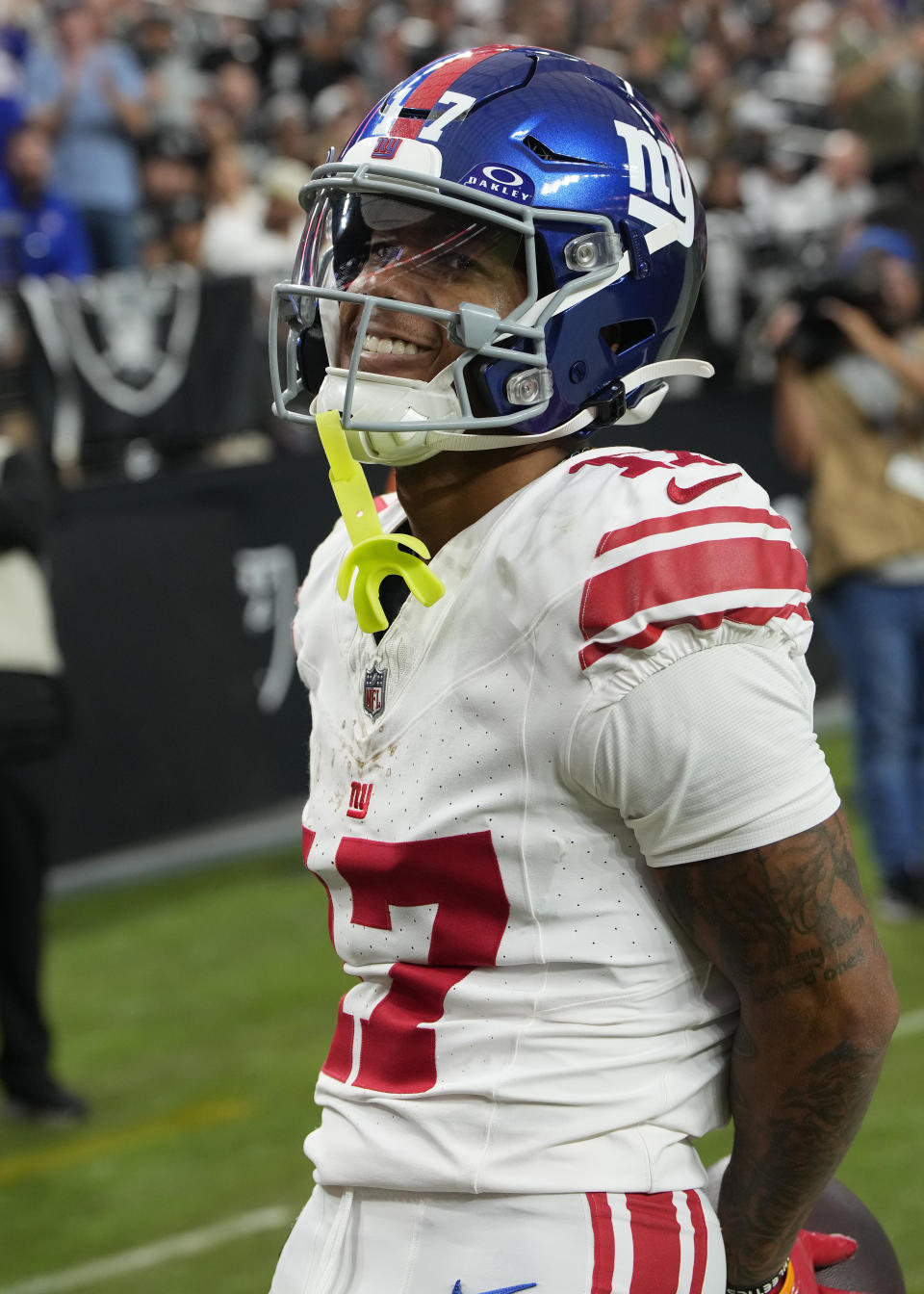 New York Giants wide receiver Wan'Dale Robinson (17) smiles after a touchdown against the Las Vegas Raiders during the second half of an NFL football game, Sunday, Nov. 5, 2023, in Las Vegas. (AP Photo/Rick Scuteri)