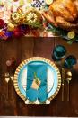 <p>Embrace a bold color palette, such as teal and gold, for your tablescape, and use those colors to choose everything from your charger plates to your napkins.</p><p><a class="link " href="https://www.amazon.com/Ruvanti-Cotton-Napkins-Comfortable-Reusable/dp/B07NKHNZYD?tag=syn-yahoo-20&ascsubtag=%5Bartid%7C10070.g.23289609%5Bsrc%7Cyahoo-us" rel="nofollow noopener" target="_blank" data-ylk="slk:SHOP TEAL NAPKINS;elm:context_link;itc:0;sec:content-canvas">SHOP TEAL NAPKINS</a></p>